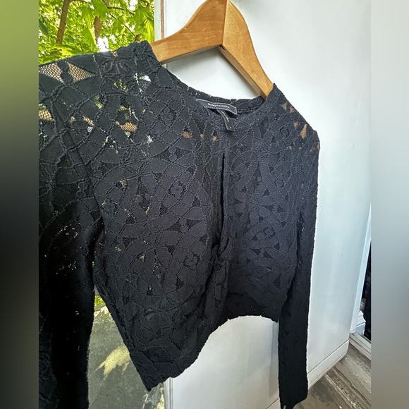 BCBG MaxAzria black lace crop top.Has a split in chest area.Very stretchy.Size S - Picture 3 of 4